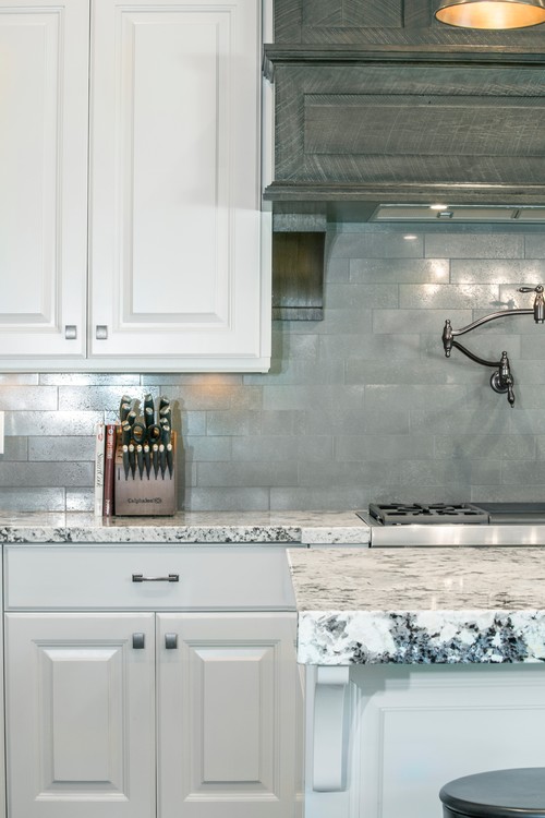 White Ice with White Cabinets and Stainless Steel Subway Backsplash